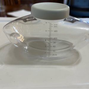 Elvie milk storage bottles with lids